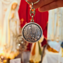 Load image into Gallery viewer, Pope Francis Keychain - Silver keychain with a circular pendant featuring an engraved portrait of Pope Fracis and the Apparitions of Fatima
